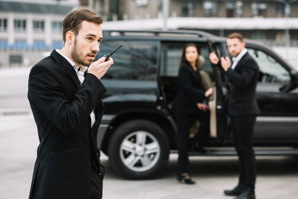 bodyguard helping client of car